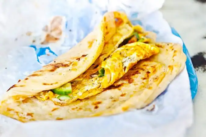 Egg-stuffed parotta hot off the griddle